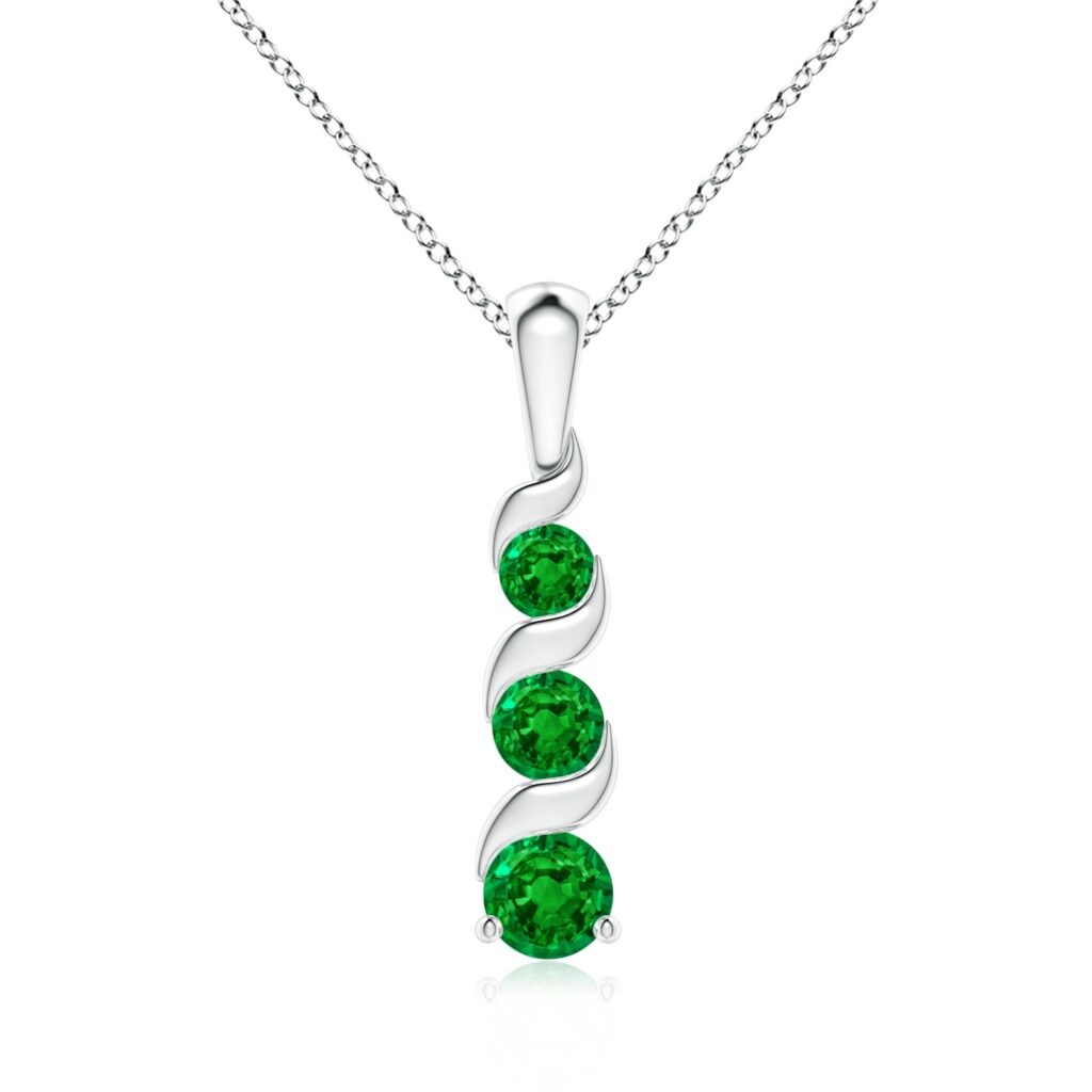 Three emerald pendant necklace showcasing the Taurus birthstone.