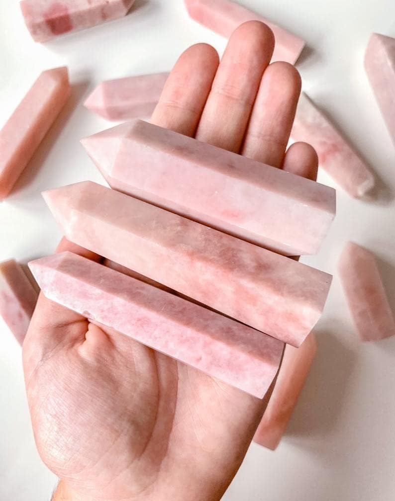 Natural pink opal crystal wand for meditation.