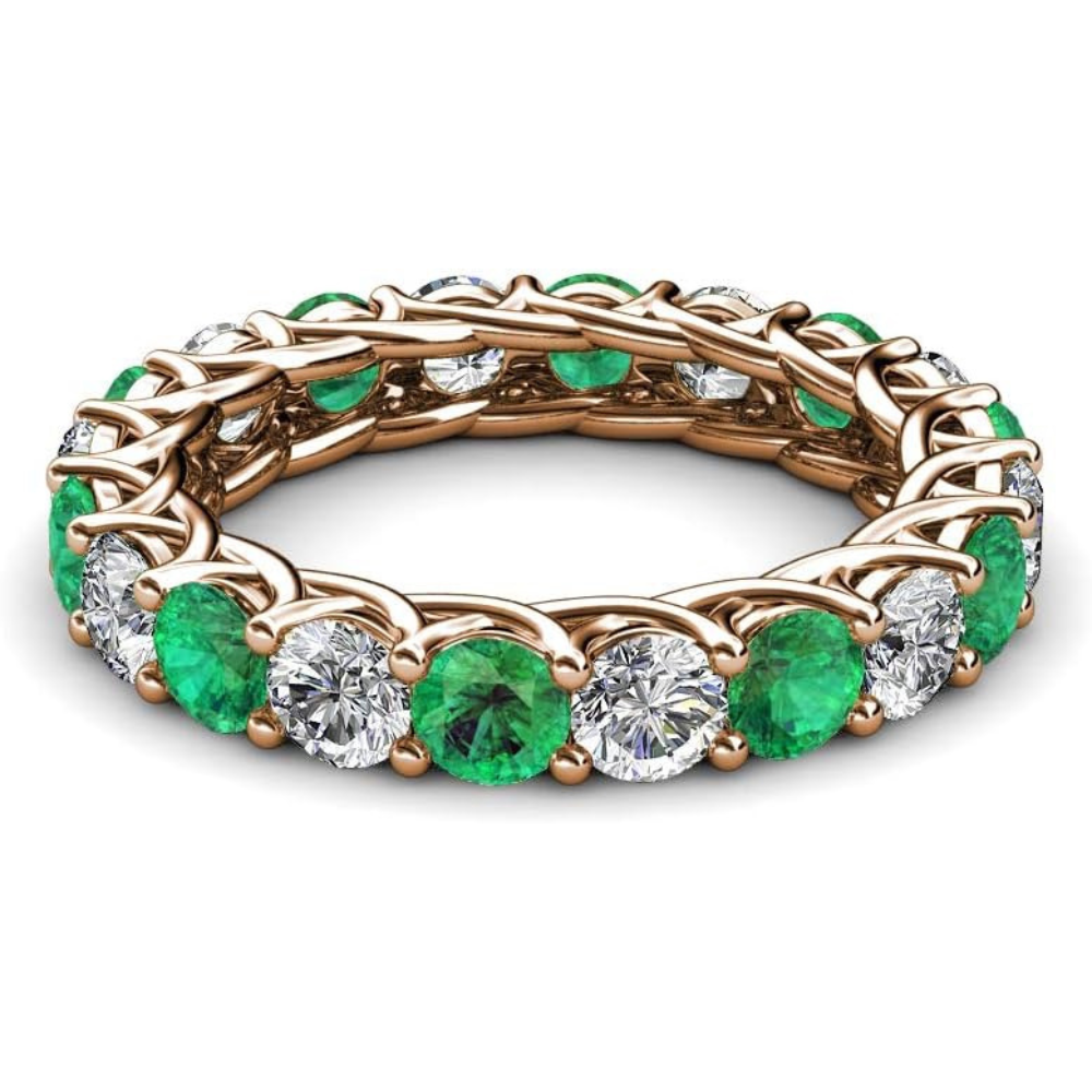 Emerald jewelry to covet: full circle of emeralds and diamonds make this eternity band truly special.